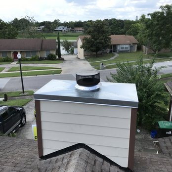 Chimney inspection — rusted cap before replacement