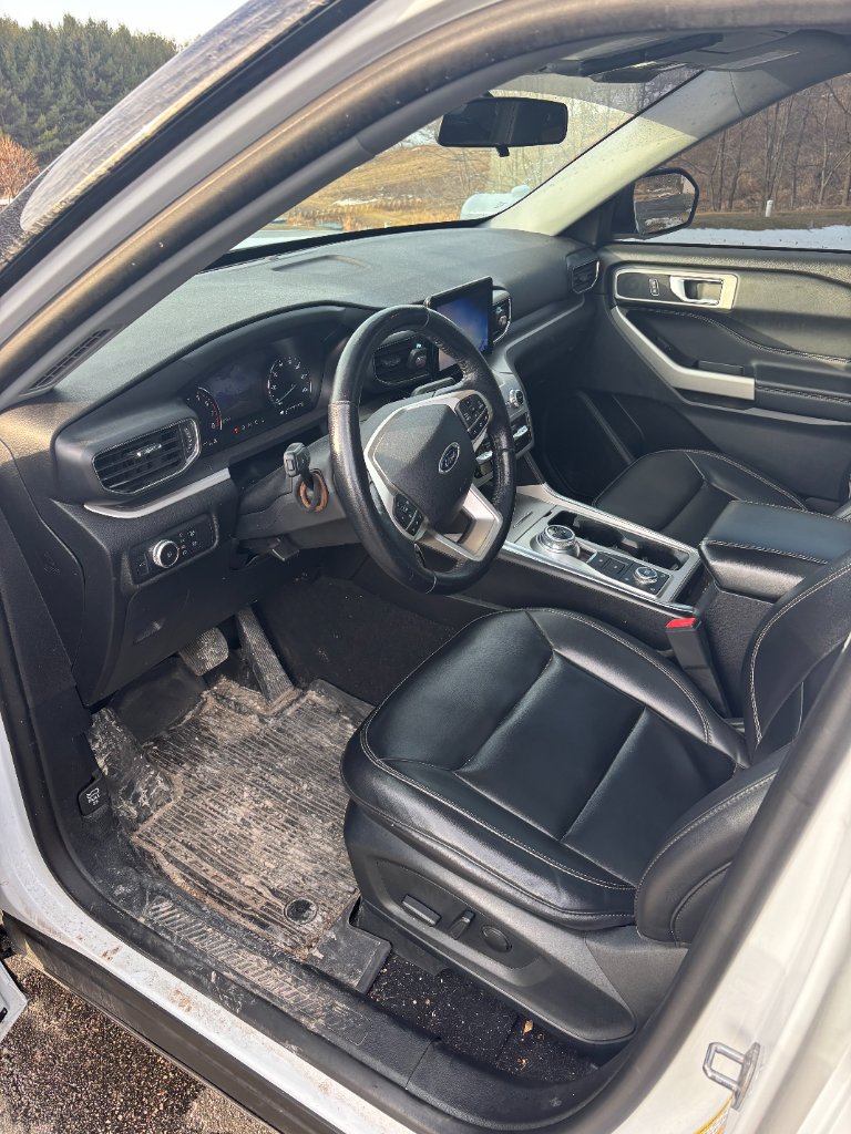 GMC Sierra dirty interior with mud and debris before detailing