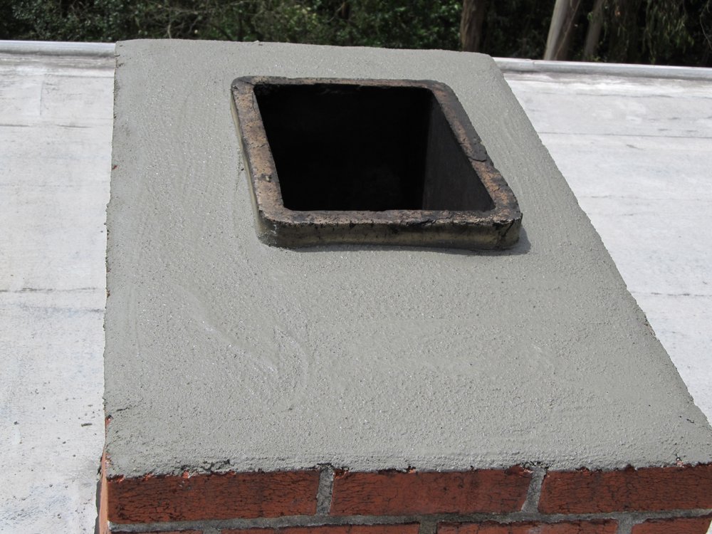 Chimney rebuild in progress - brick removal