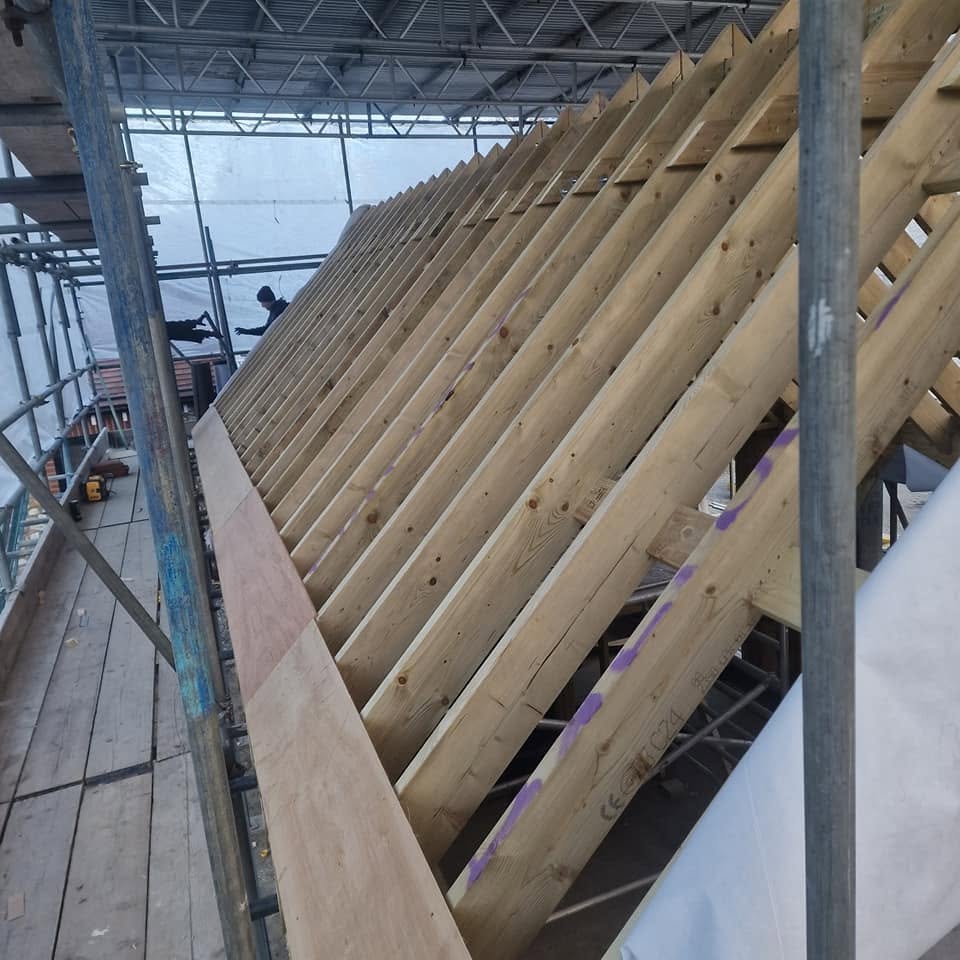 Roof repair and replacement work in progress by Bumblebee Roofing