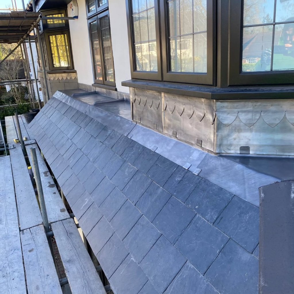 Completed slate roofing project by Bumblebee Roofing Ltd