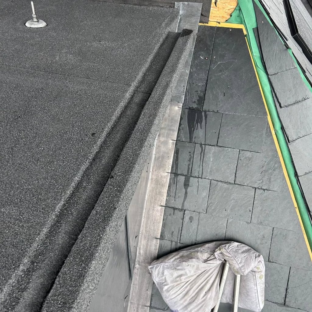 Flat roof installation using EPDM rubber membrane by Bumblebee Roofing