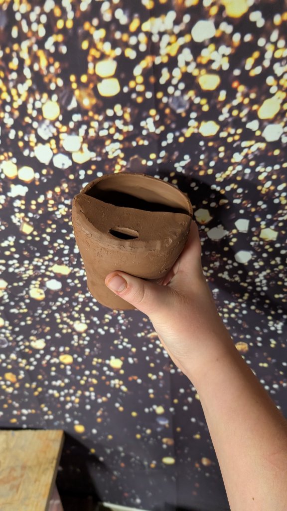 Pinched clay vessel