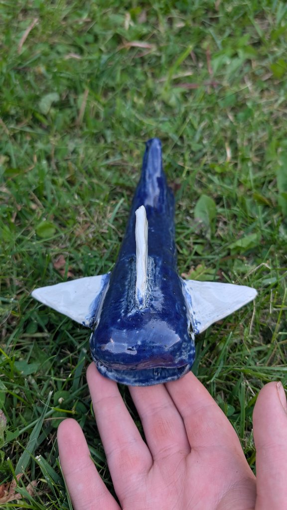 Blue glazed ceramic shark front view