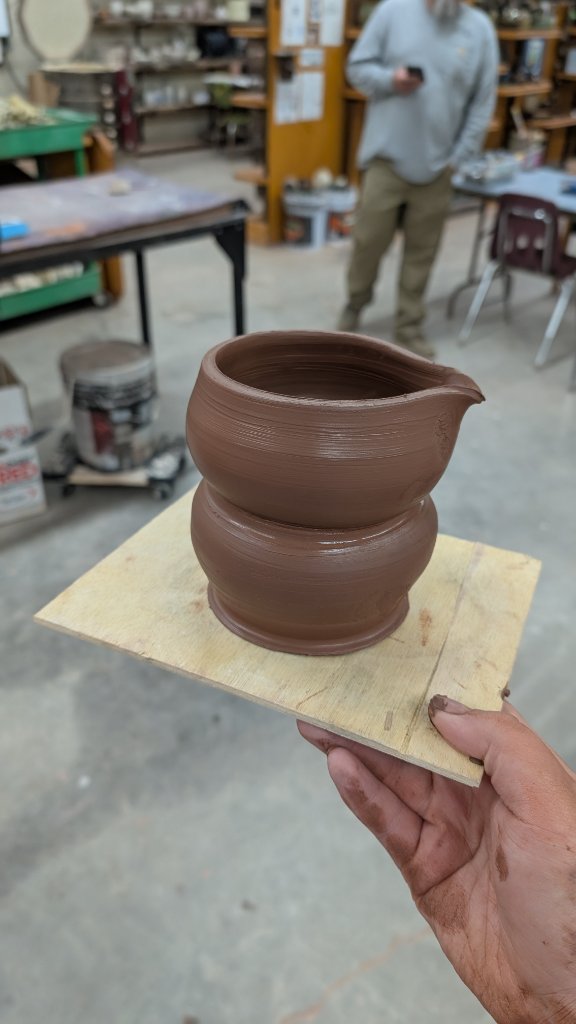Dark clay pitcher freshly thrown