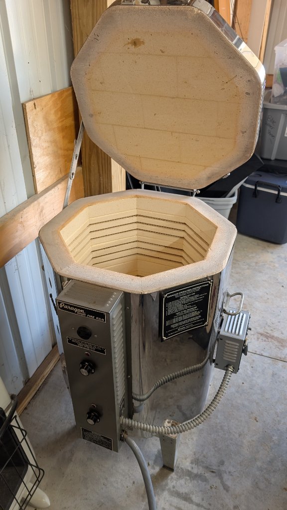 Paragon kiln with lid open in garage