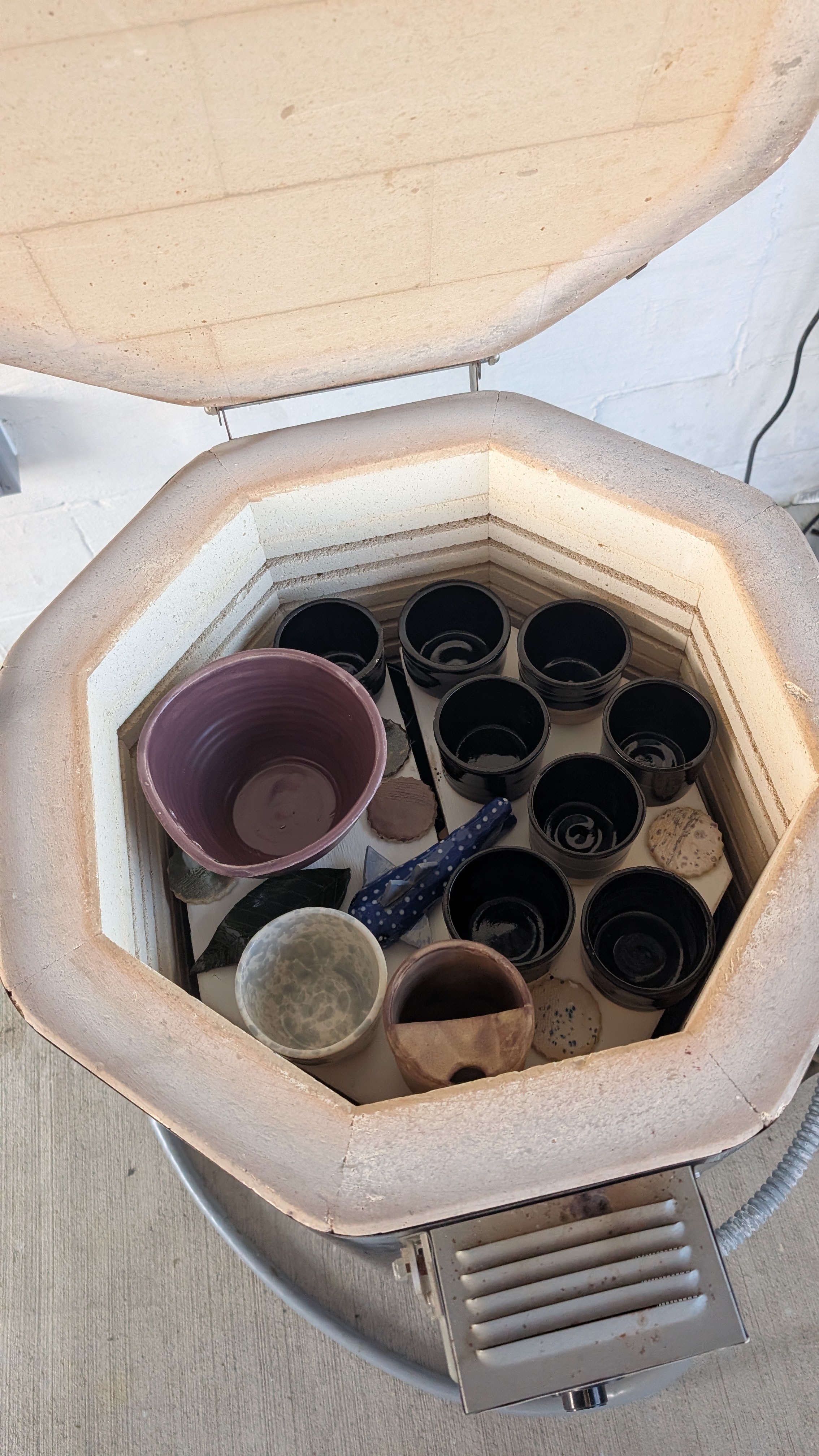 Top-down view of kiln loaded with ceramic ware