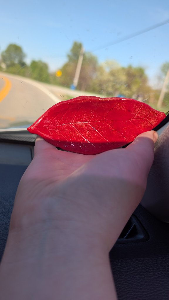 Red glazed ceramic leaf dish