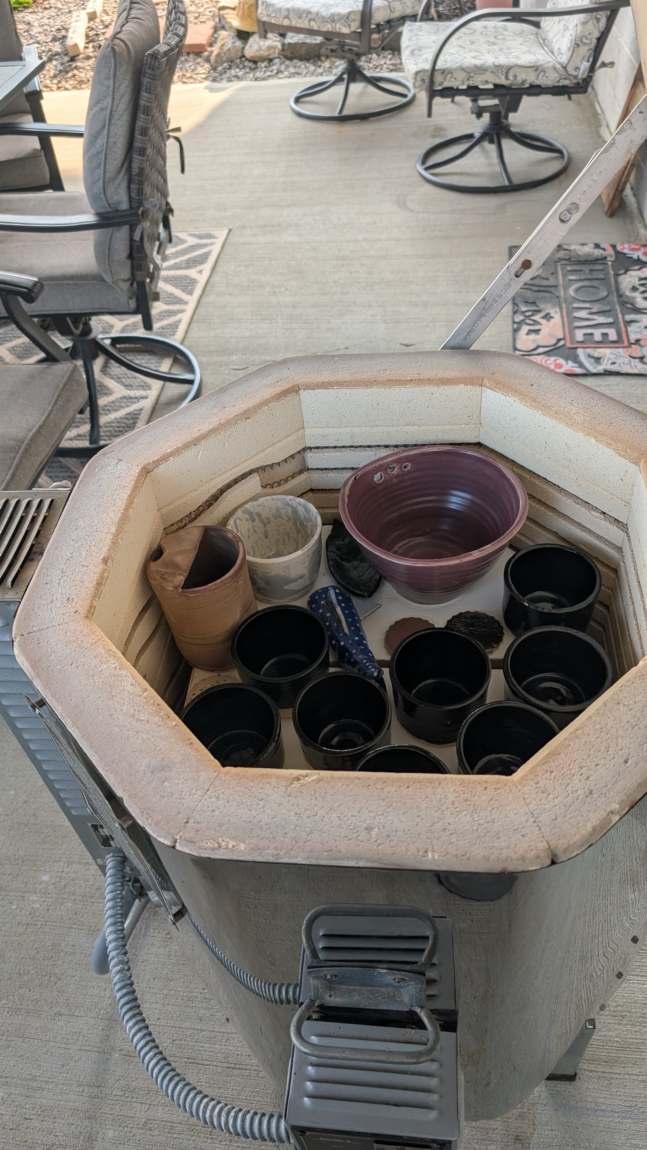 Kiln packed with glazed ceramic pieces