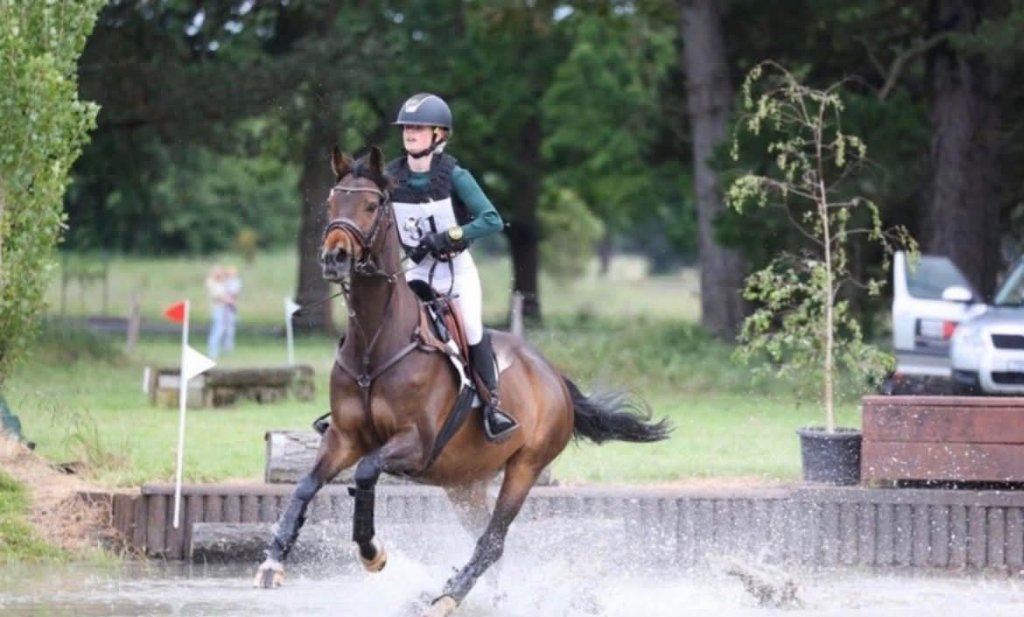 Cross-country water jump in action
