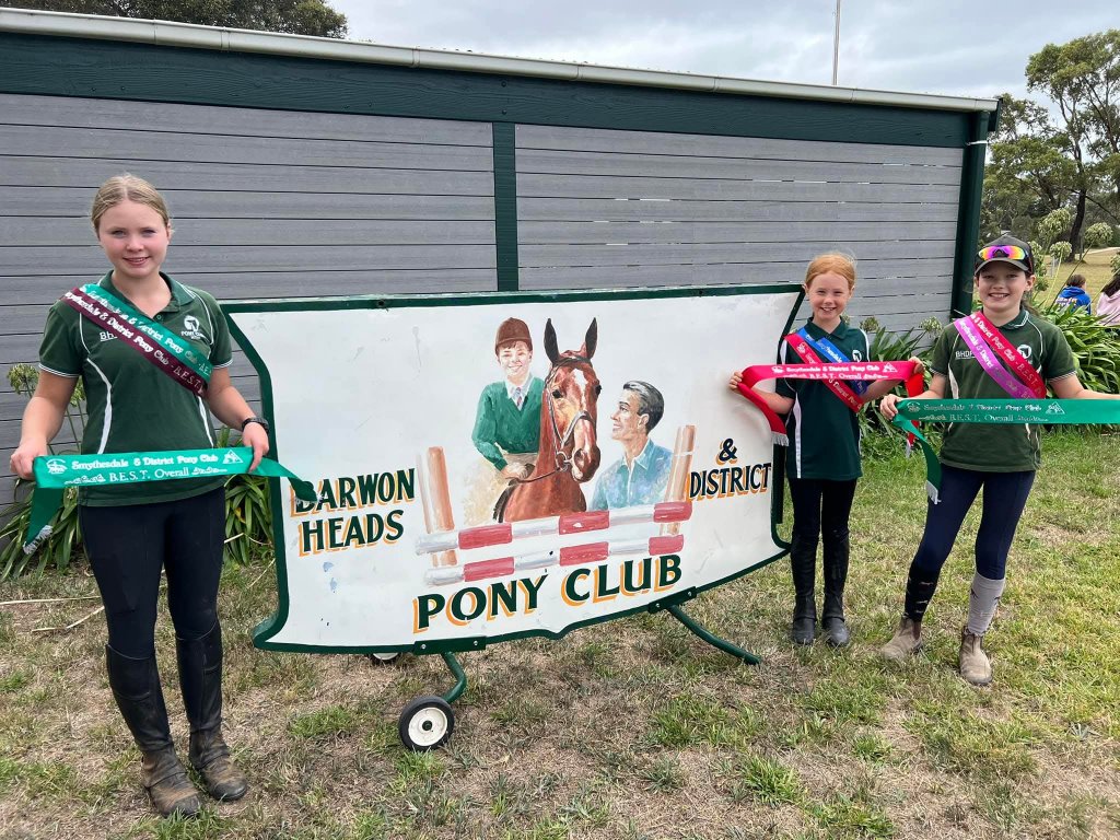 Proud riders with their ribbons behind the club jump