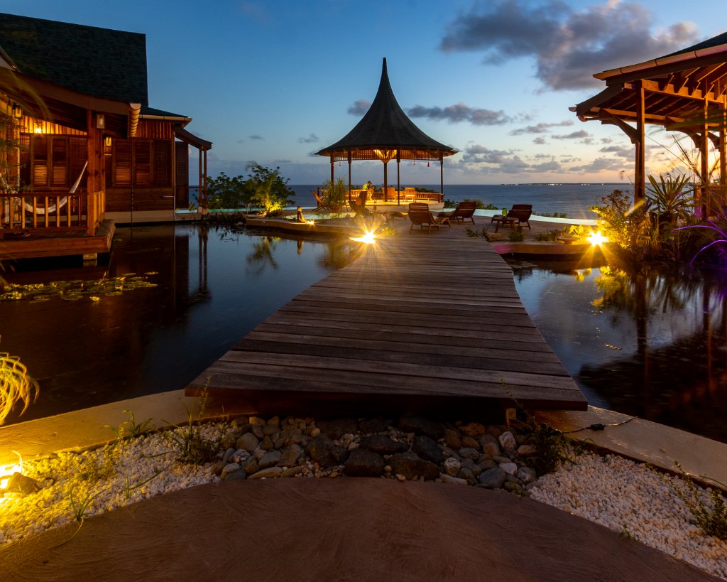 Koi pond boardwalk & gazebo at dusk