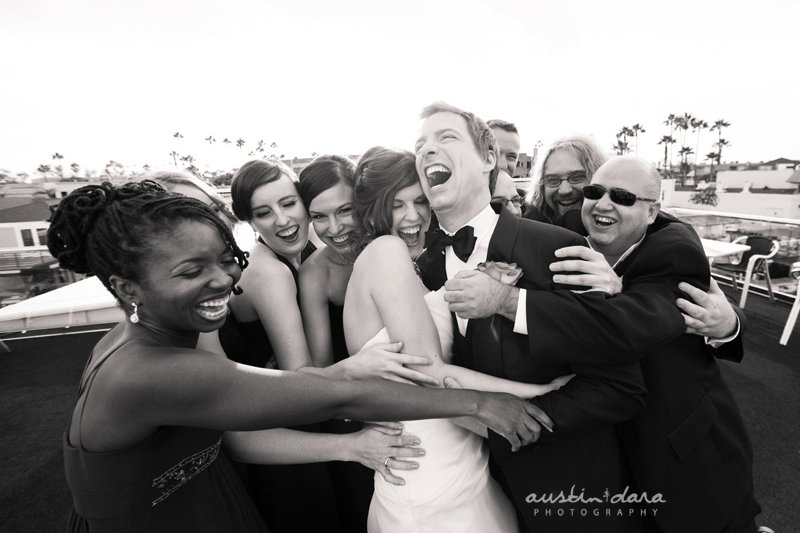 Wedding group shot laughing