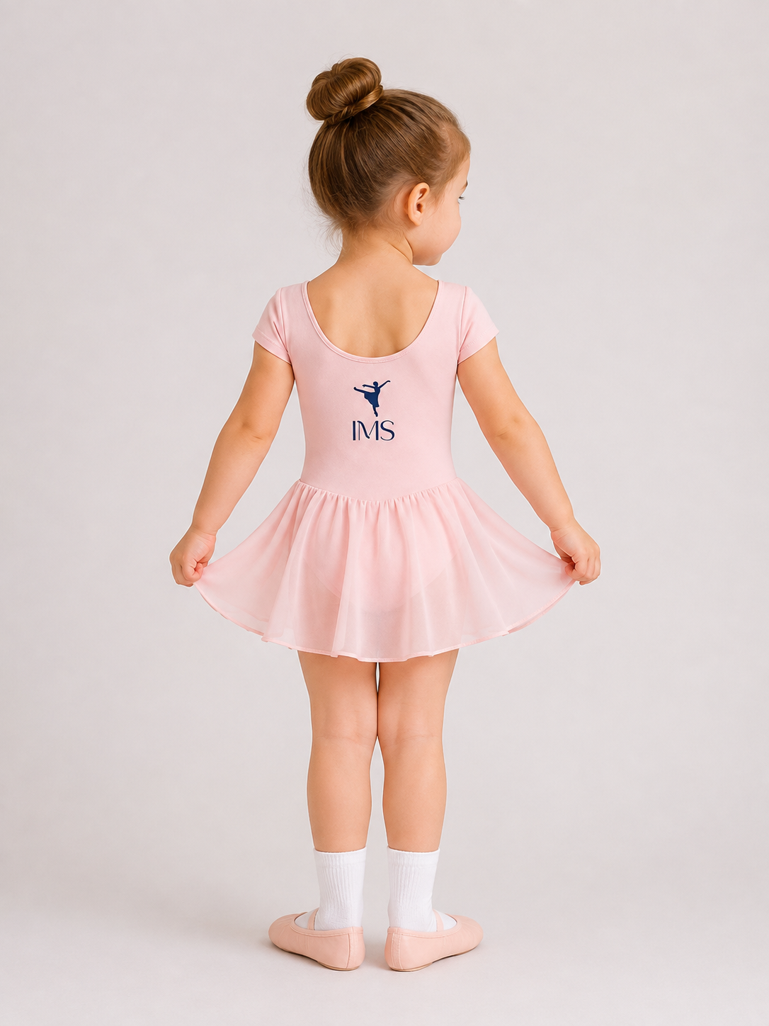 Pink leotard with chiffon skirt — back view