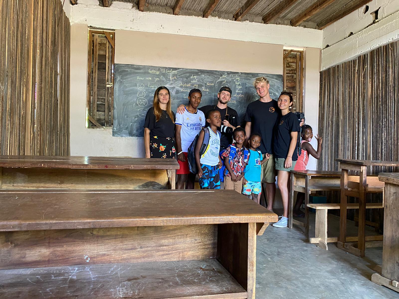 Interns with students in a classroom