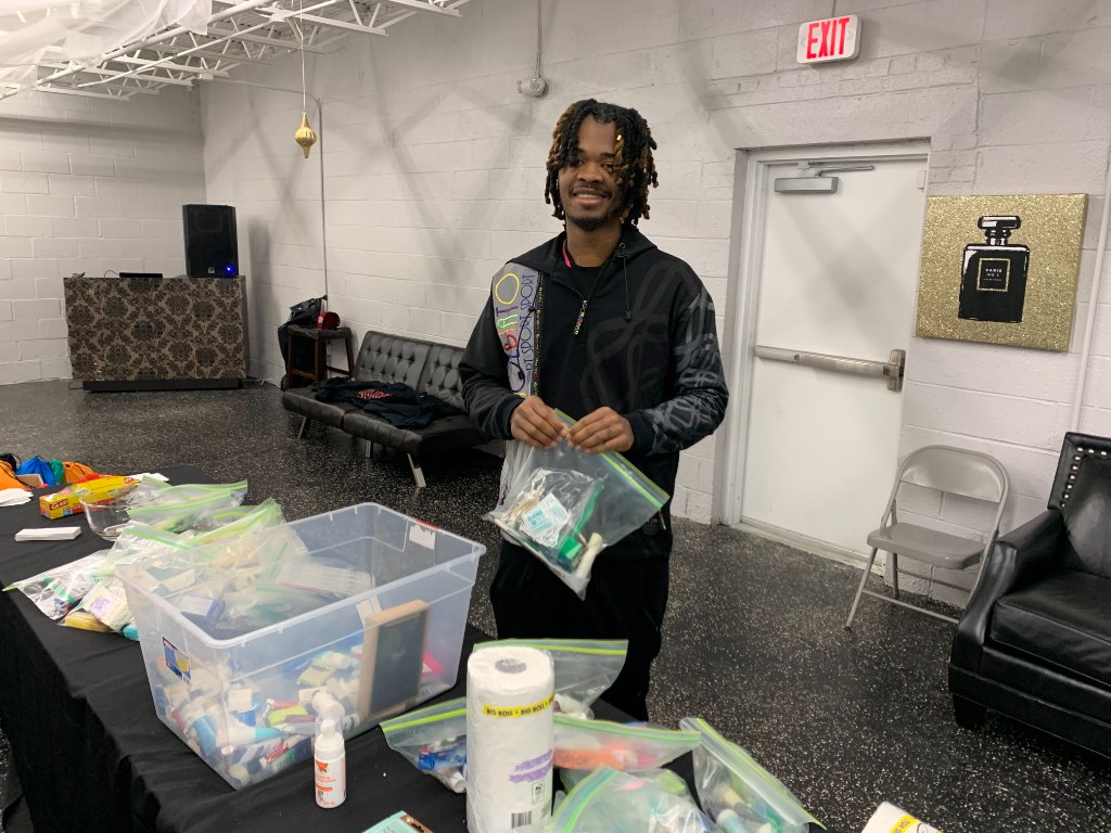Community Outreach volunteer packing hygiene kits