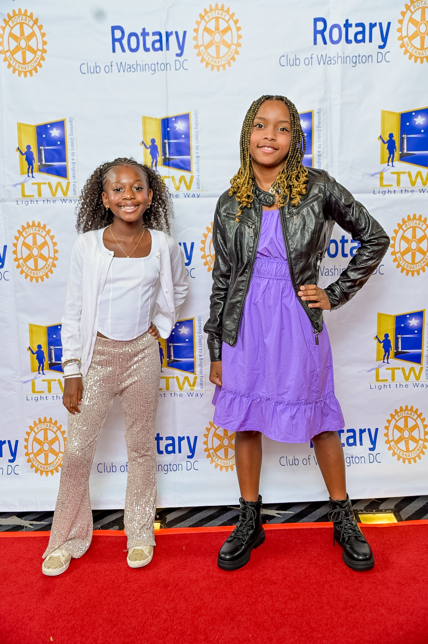 Two young girls posing on the Red Carpet at the 2026 Premiere