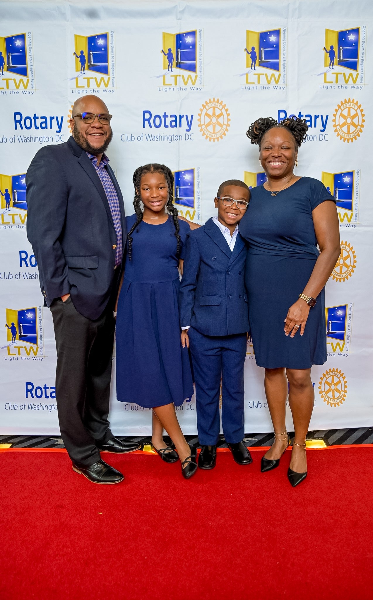 Family of four posing on the Red Carpet at the 2026 Premiere