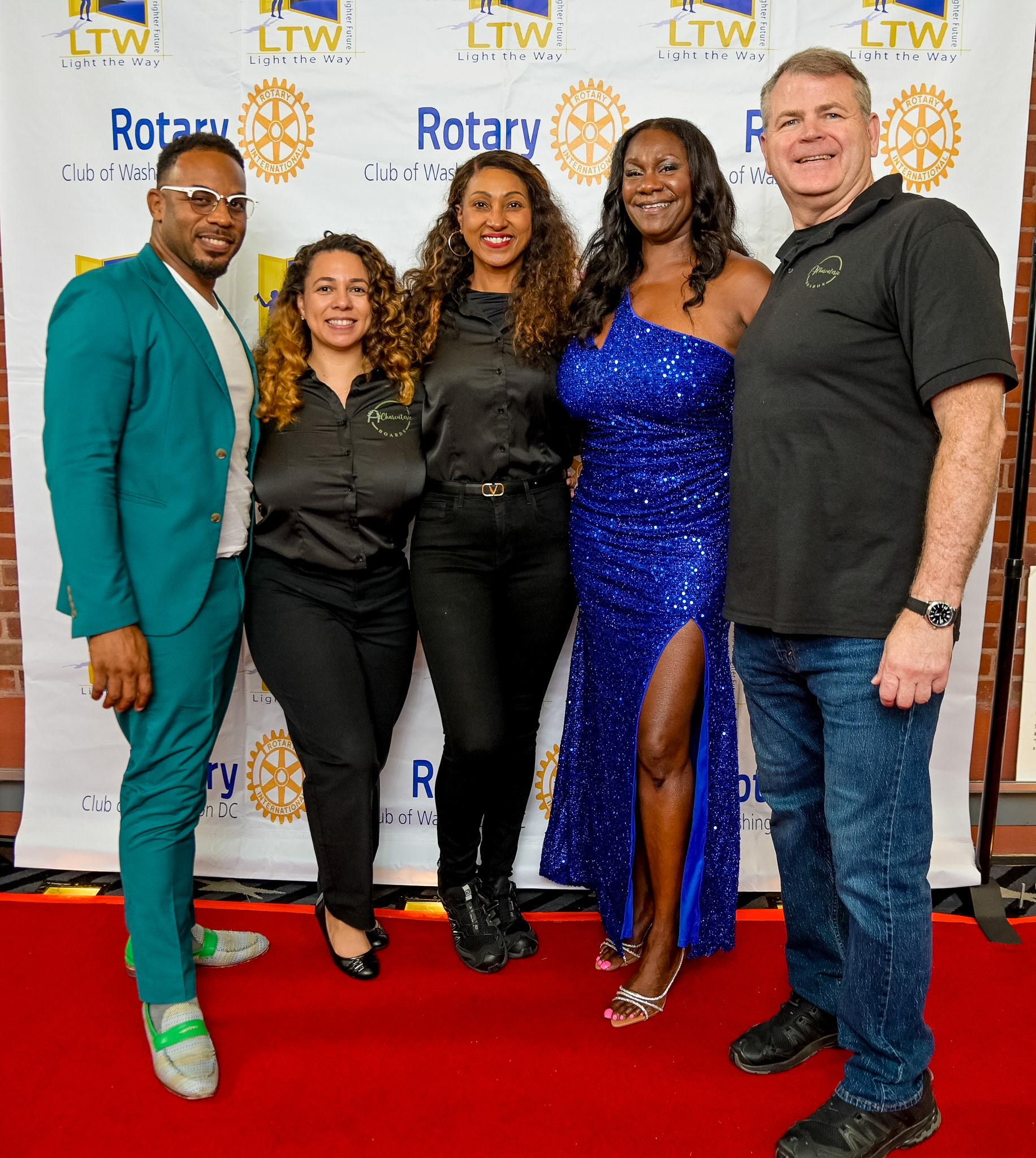 Group of five guests posing on the Red Carpet at the 2026 Premiere
