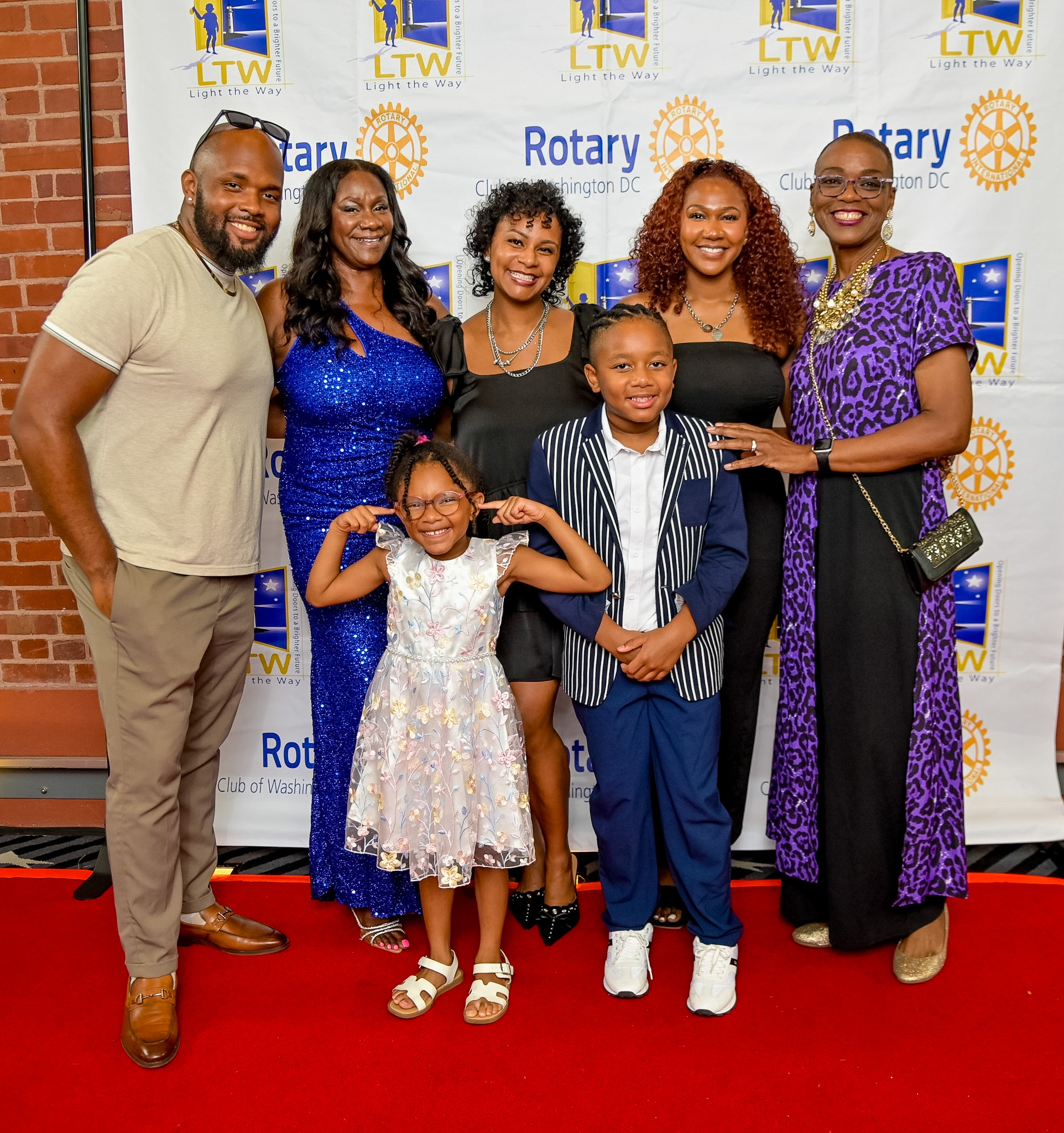 Group of six posing on the Red Carpet at the 2026 Premiere