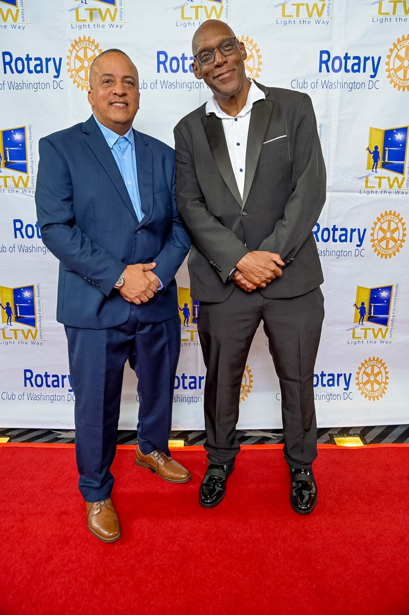 Two men in suits posing on the Red Carpet at the 2026 Premiere