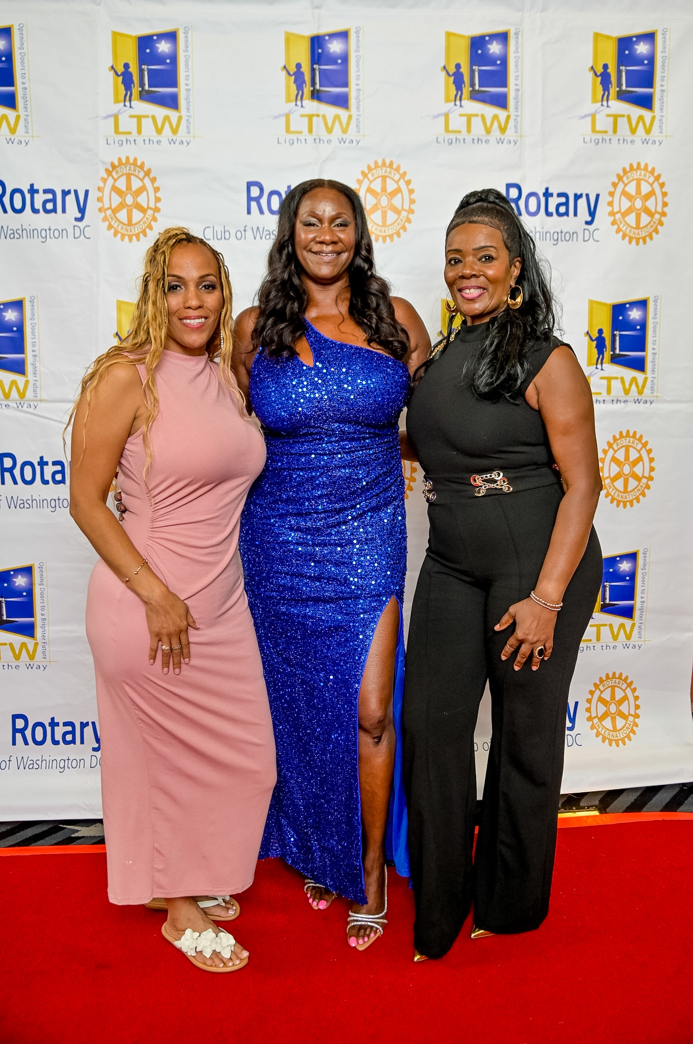 Three women posing together on the Red Carpet at the 2026 Premiere