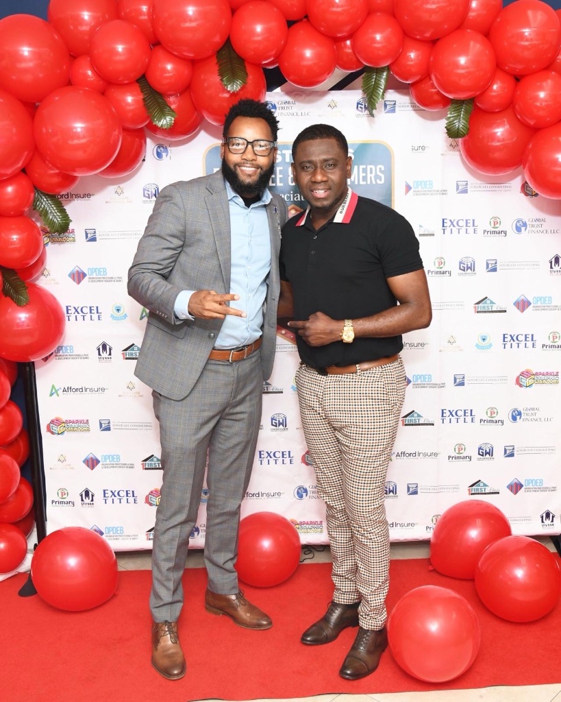 Luckner Dorcy with partners on the red carpet