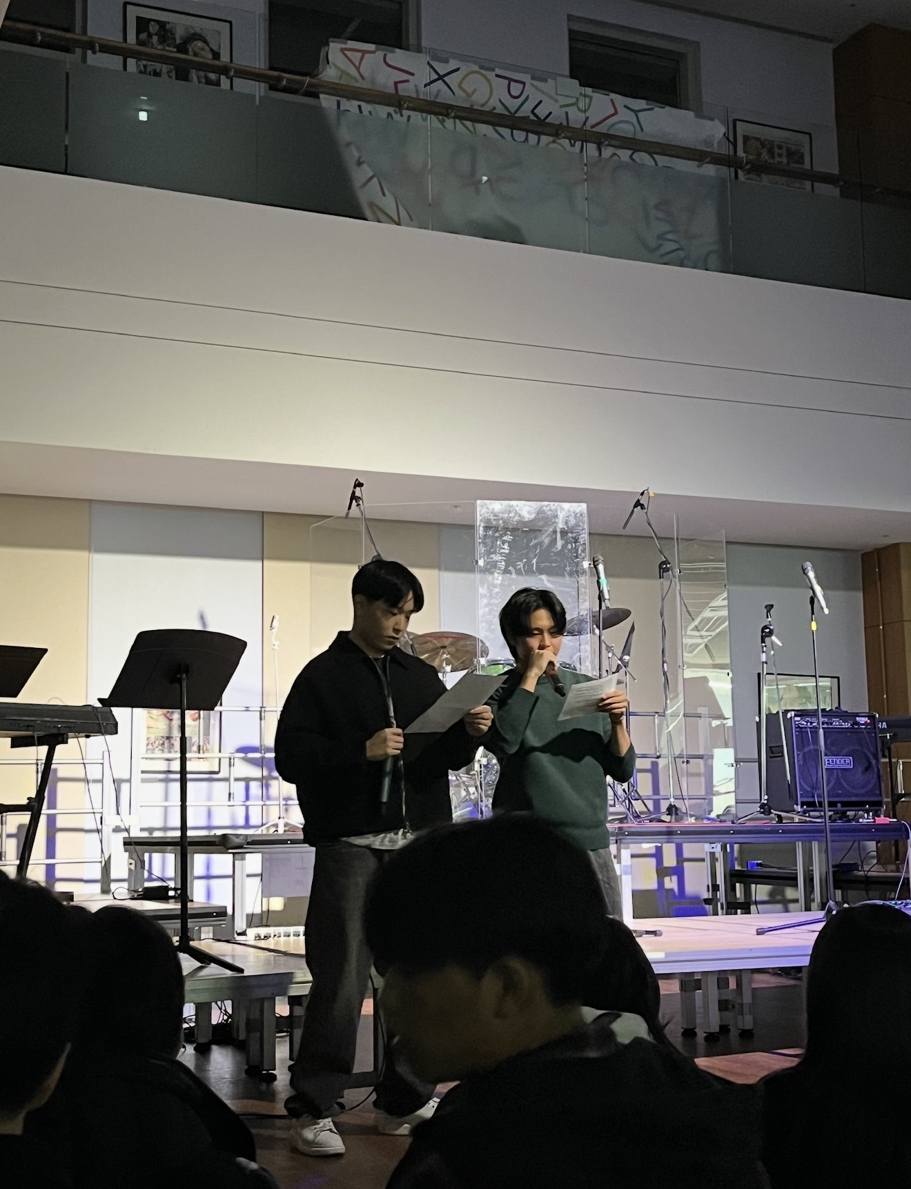 Ambassadors Jiho and Jiwon delivering a pre-concert lecture on the sustainability impact of performance technology