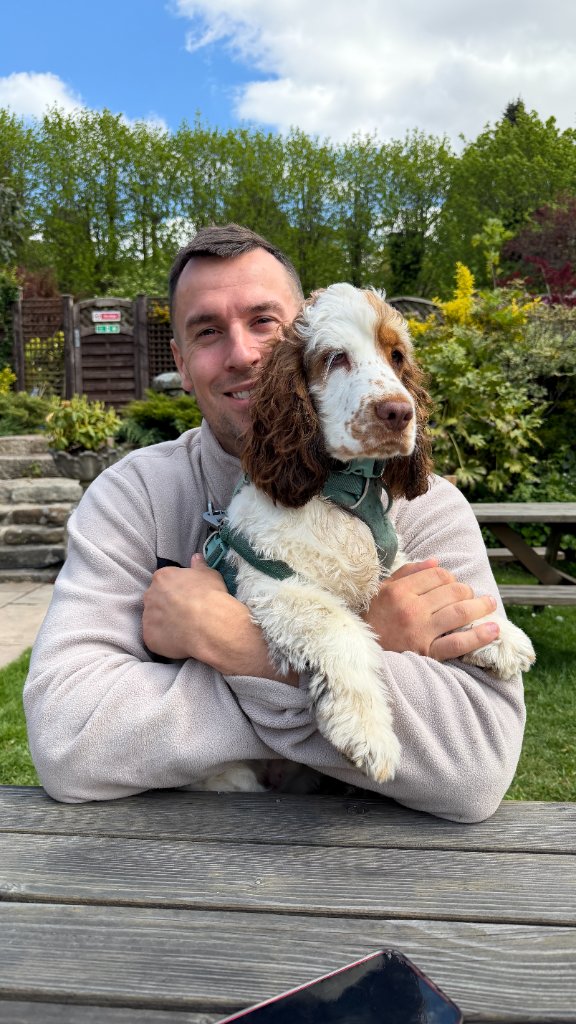 Matt sharing a gentle moment with Baxter during a calm walk and sniff break near House of Paws Retreat in Derbyshire