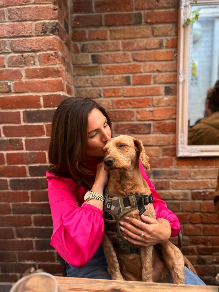 Rachel with a dog at House of Paws Retreat
