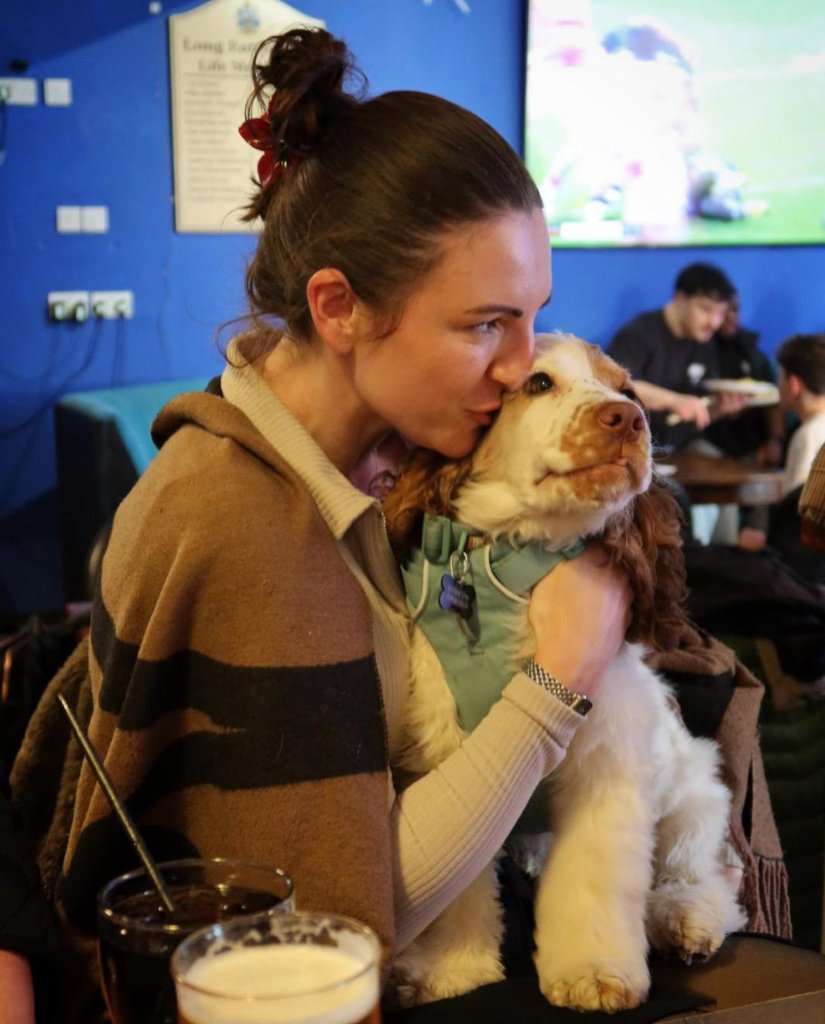 Rachel with a dog at House of Paws Retreat
