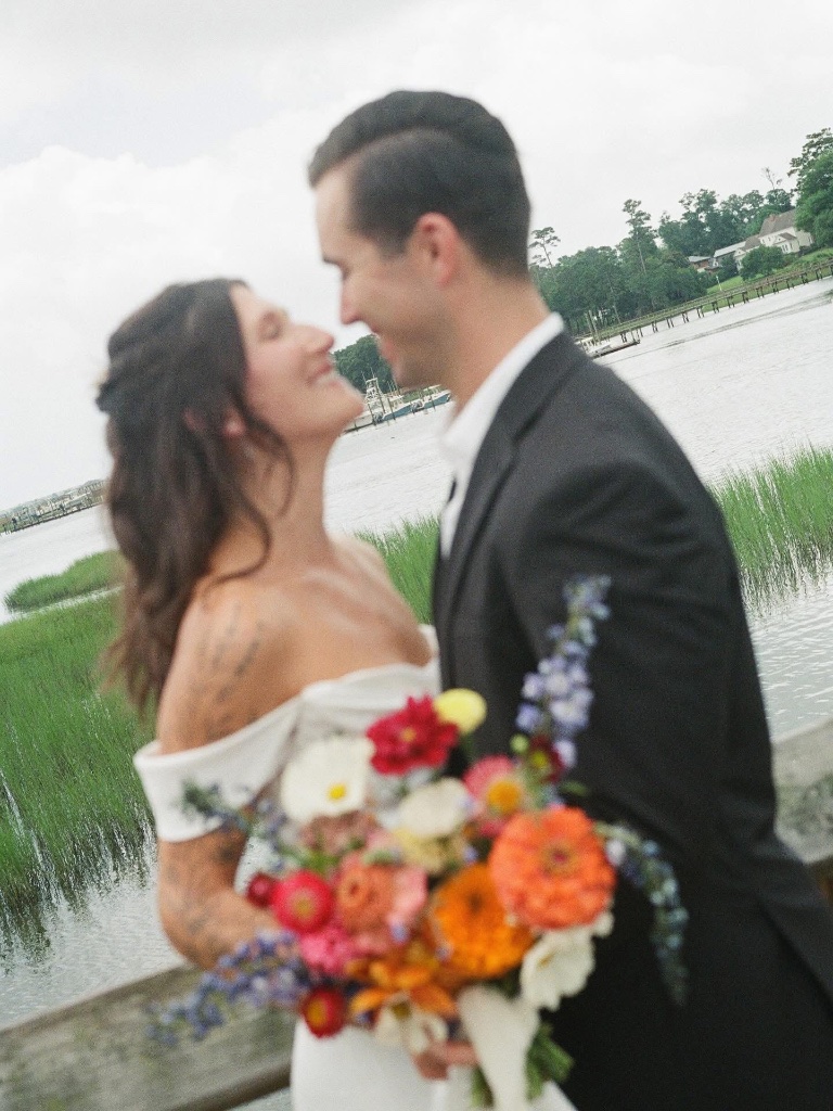 Delicate bridal bouquet with white peonies and trailing jasmine