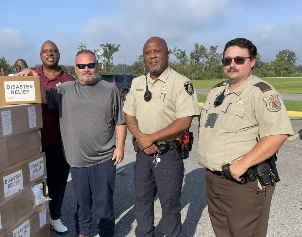 UCN volunteers and emergency responders with disaster relief supplies