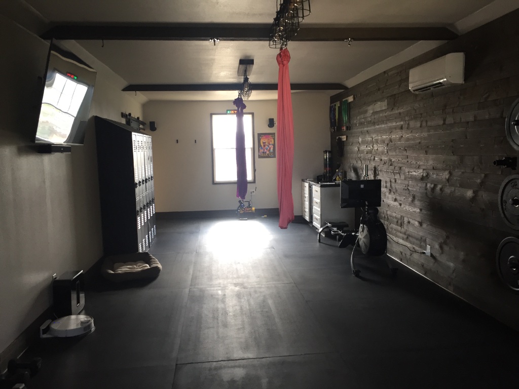 Garage Gym — Wood Beam & Stone Wall