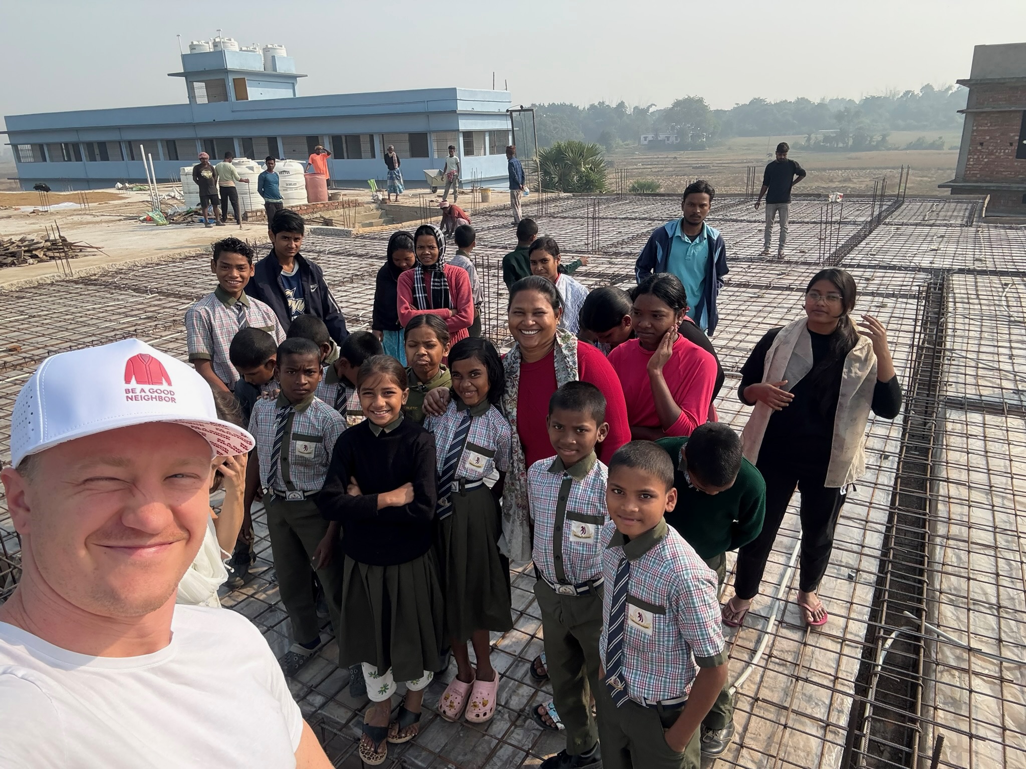 James & Ginny with the 40 children touring the almost-complete roof