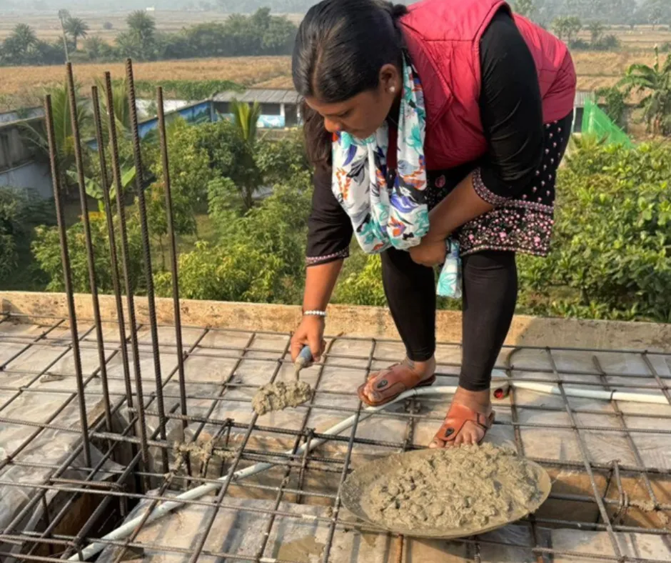 Sunita laying concrete