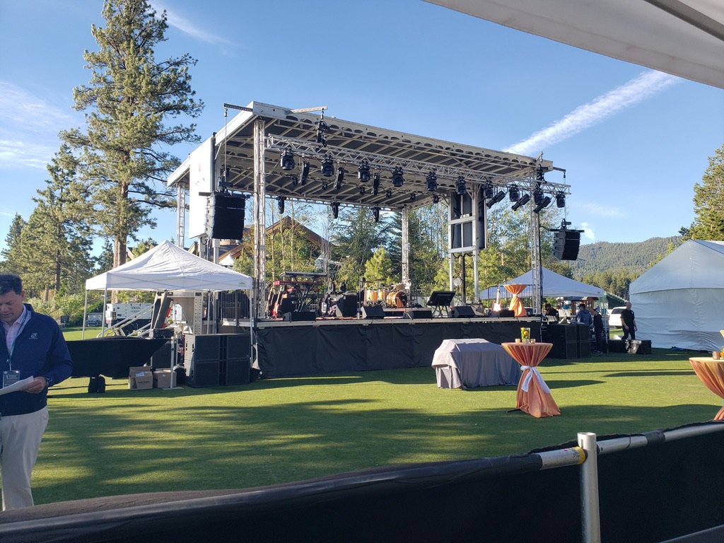 Corporate outdoor event with an APEX 3224 mobile stage, line-array speakers and lighting — corporate event production in Atlanta by Audio Visual Genius LLC