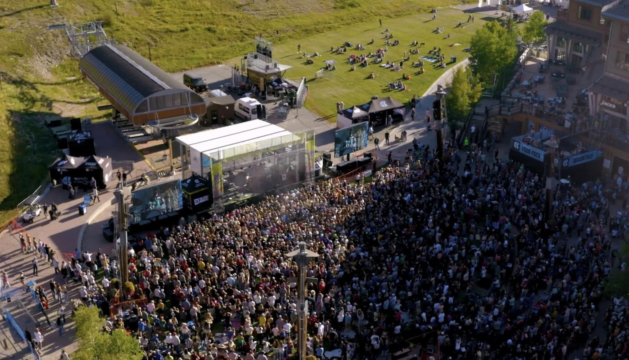Aerial view of an outdoor festival site with the APEX 3224 mobile stage — festival production in Atlanta, Georgia by Audio Visual Genius LLC