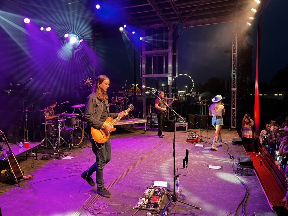 Live band performing at night on an APEX 3224 mobile stage with concert lighting — concert production in Atlanta by Audio Visual Genius LLC