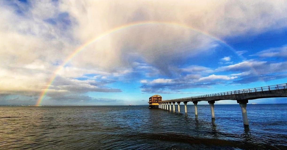 Bembridge houseboat pier under a rainbow