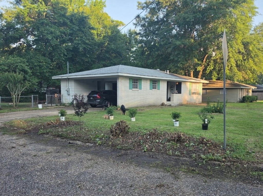 Property frontage after overgrowth removal — Laurel Mississippi
