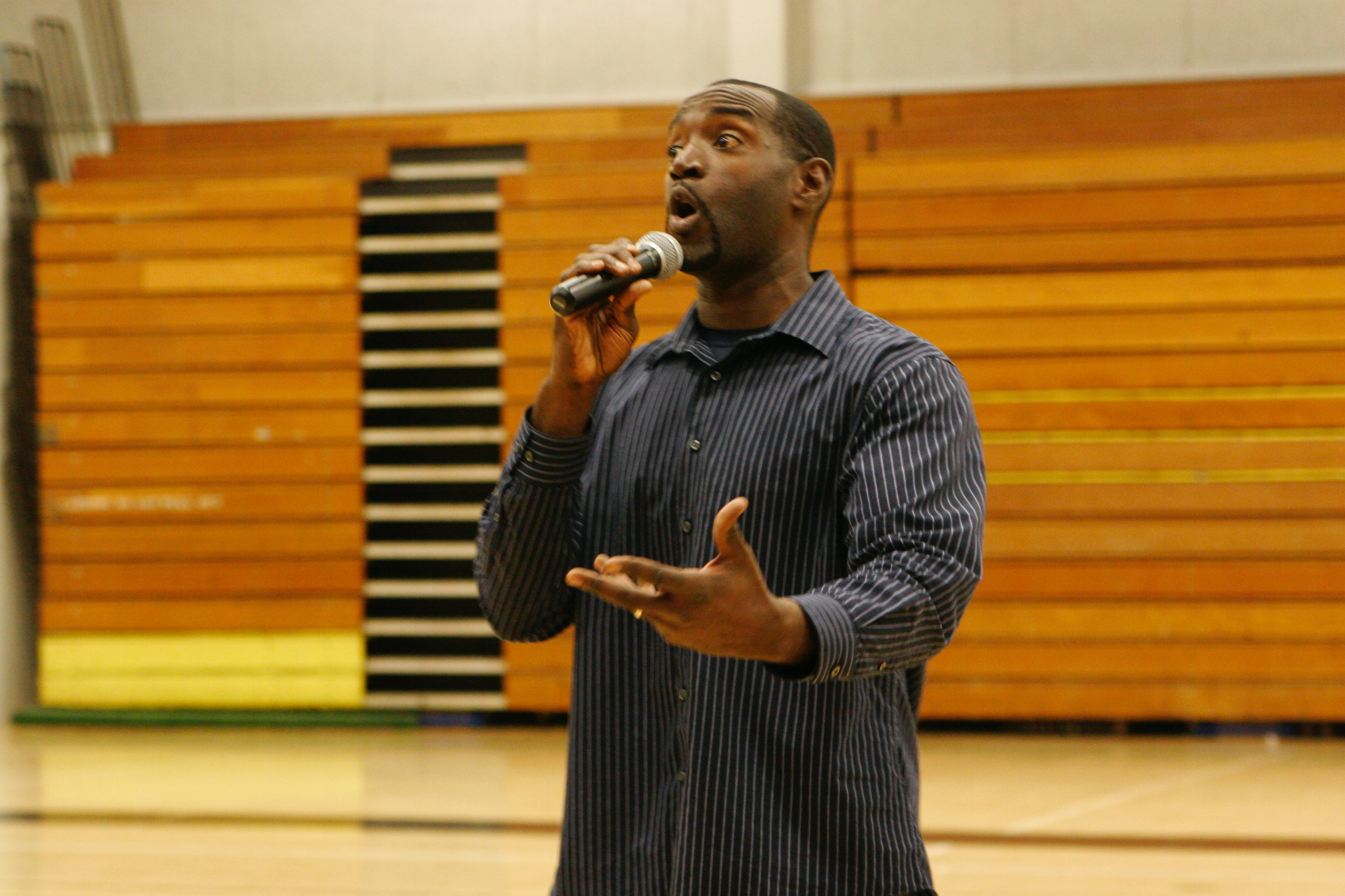 Egypt McKee speaking on a school campus · Early formation years