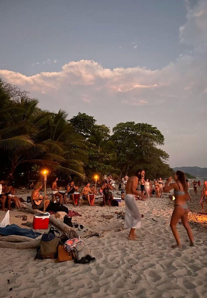 RETURN group gathering at sunset on the beach