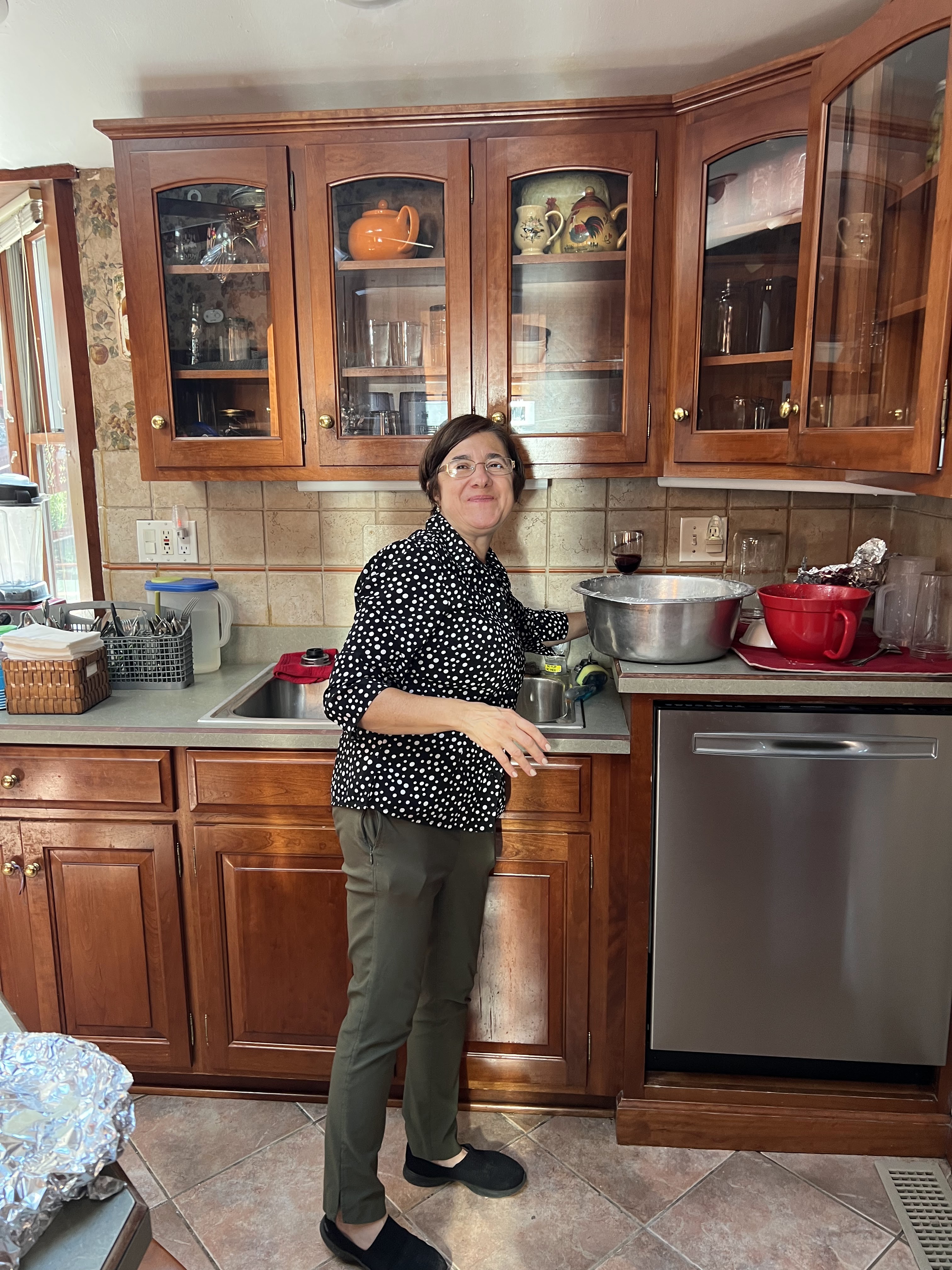 Marisa standing in her kitchen ready to cook