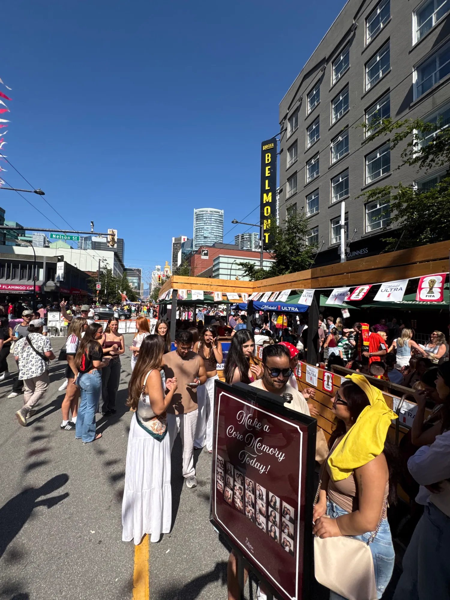 The Retro Booth's Make a Core Memory Today backdrop set up amid FIFA World Cup fan zone banners on Granville Street in Vancouver