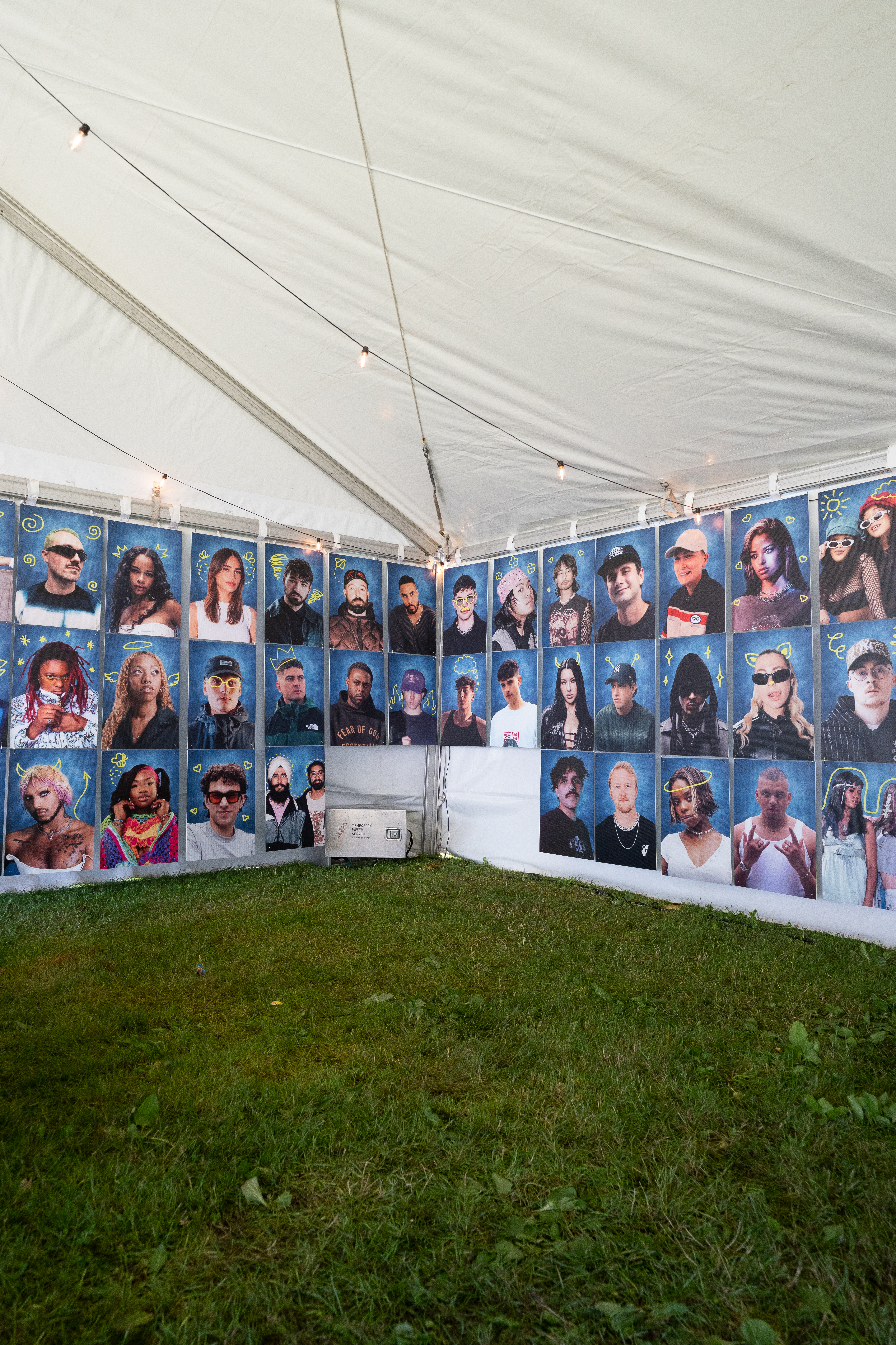 Guests using The Retro Booth's enclosed vintage photo booth at an event