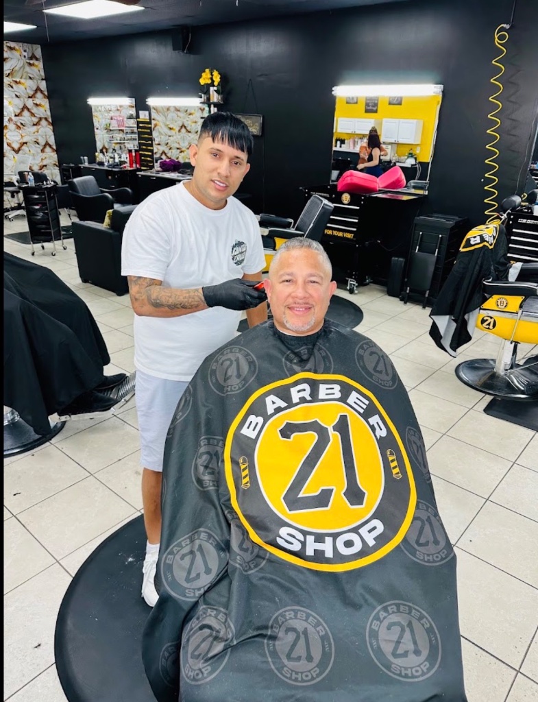 Barber and client in shop