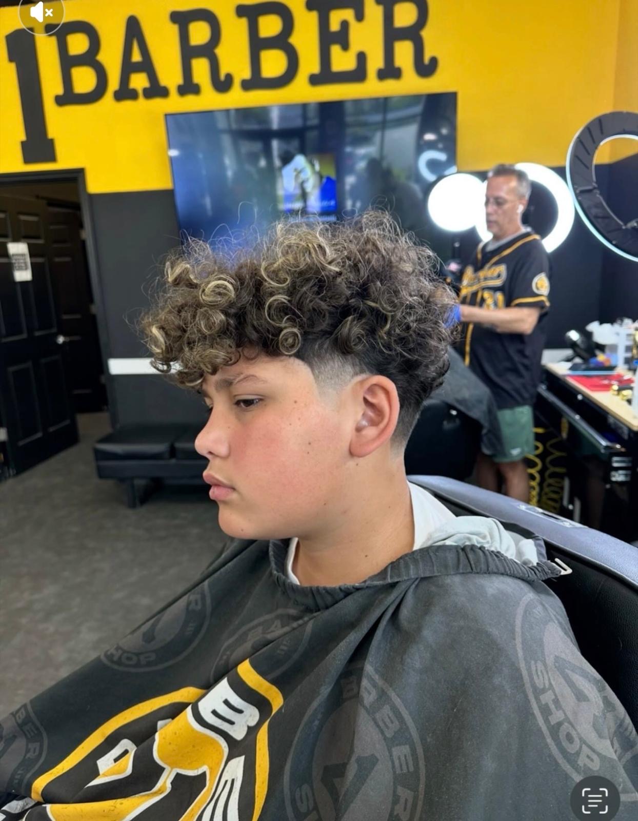 Curly highlighted hair with fade