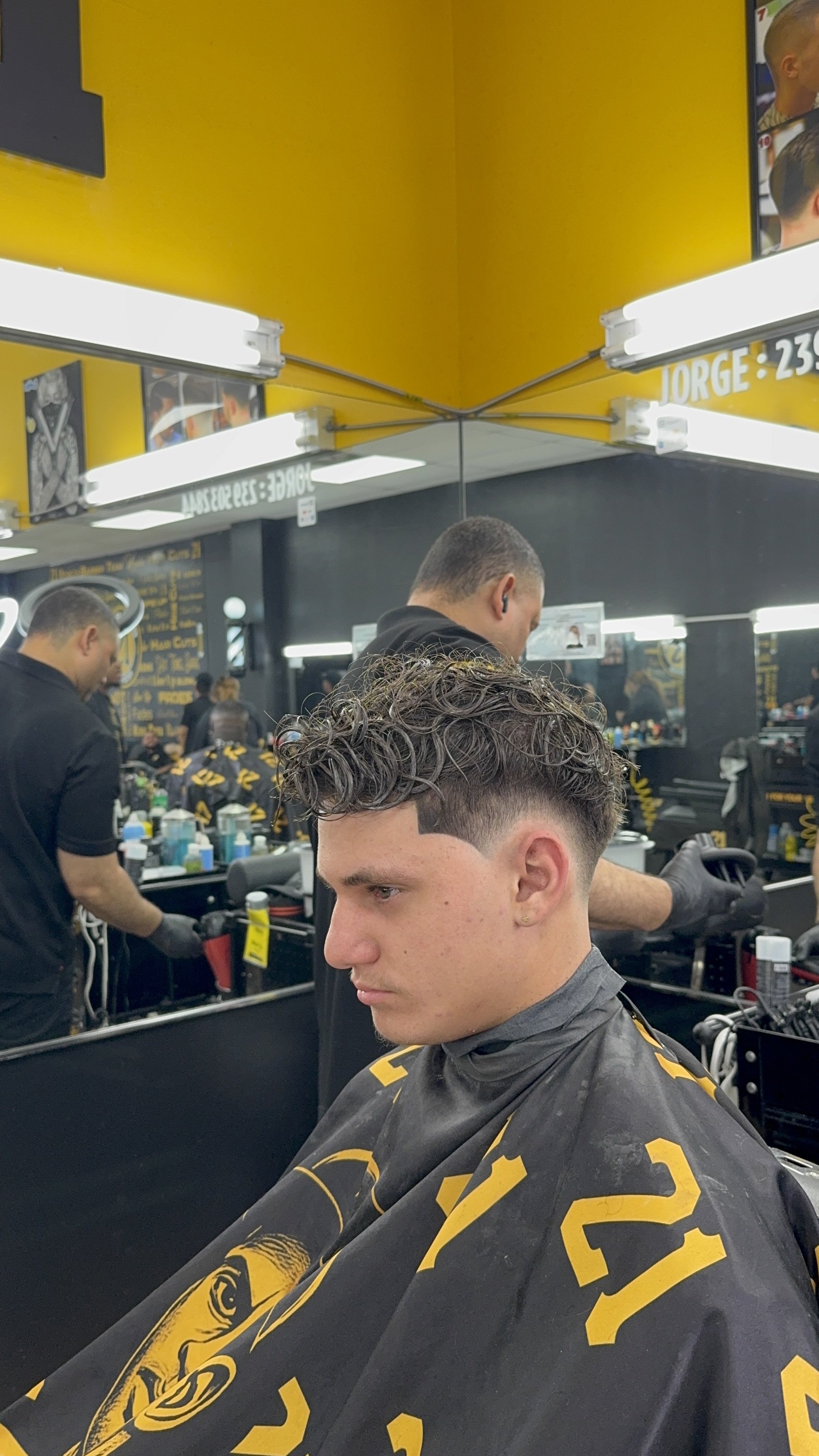 Barber styling curly hair