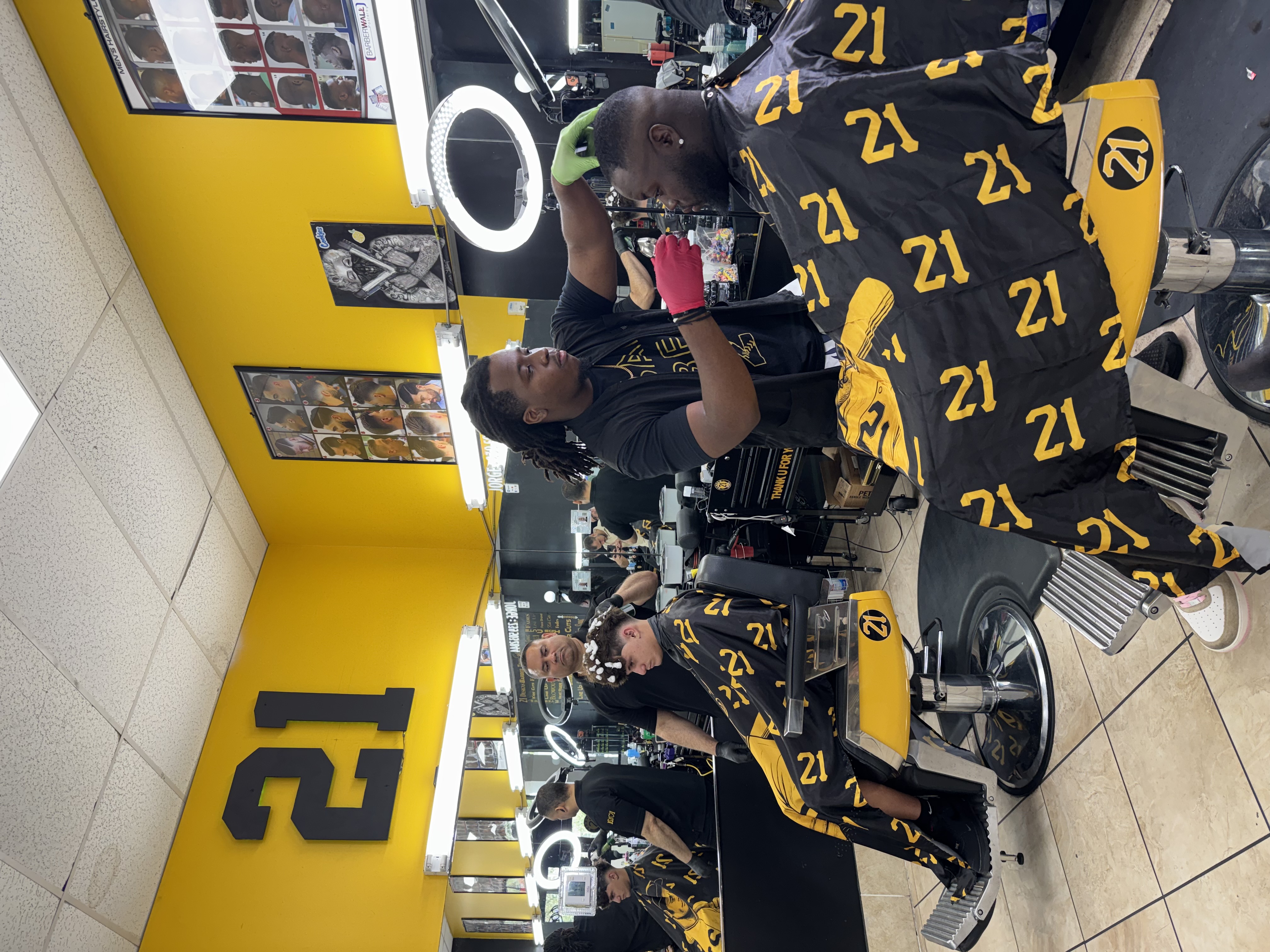 Barber cutting hair with ring light
